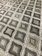 Close-up of a textured fabric with geometric pattern Stone Age