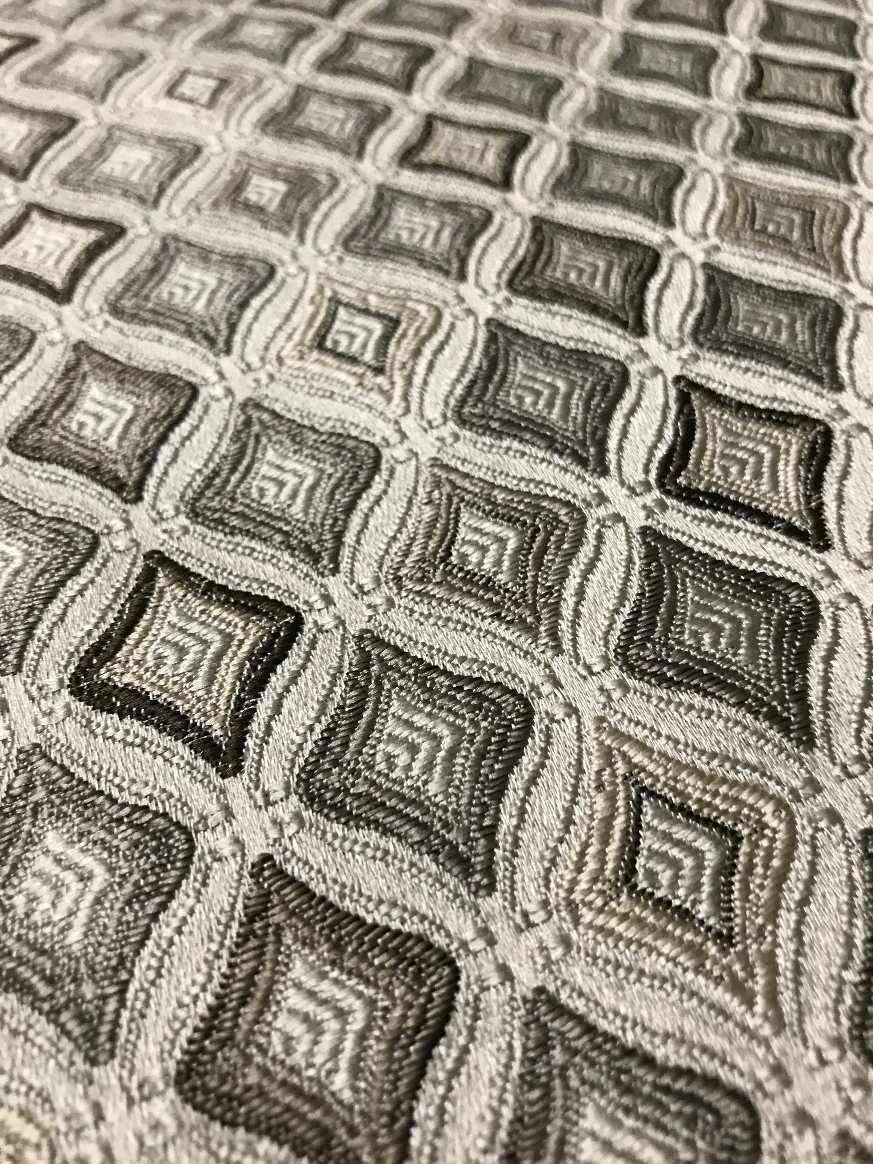 Close-up of a textured fabric with geometric pattern Stone Age