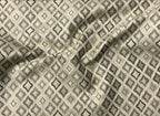 Close-up of textured fabric with diamond pattern Stone Age