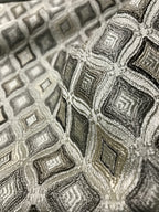 Close-up of a textured fabric with geometric pattern Stone Age