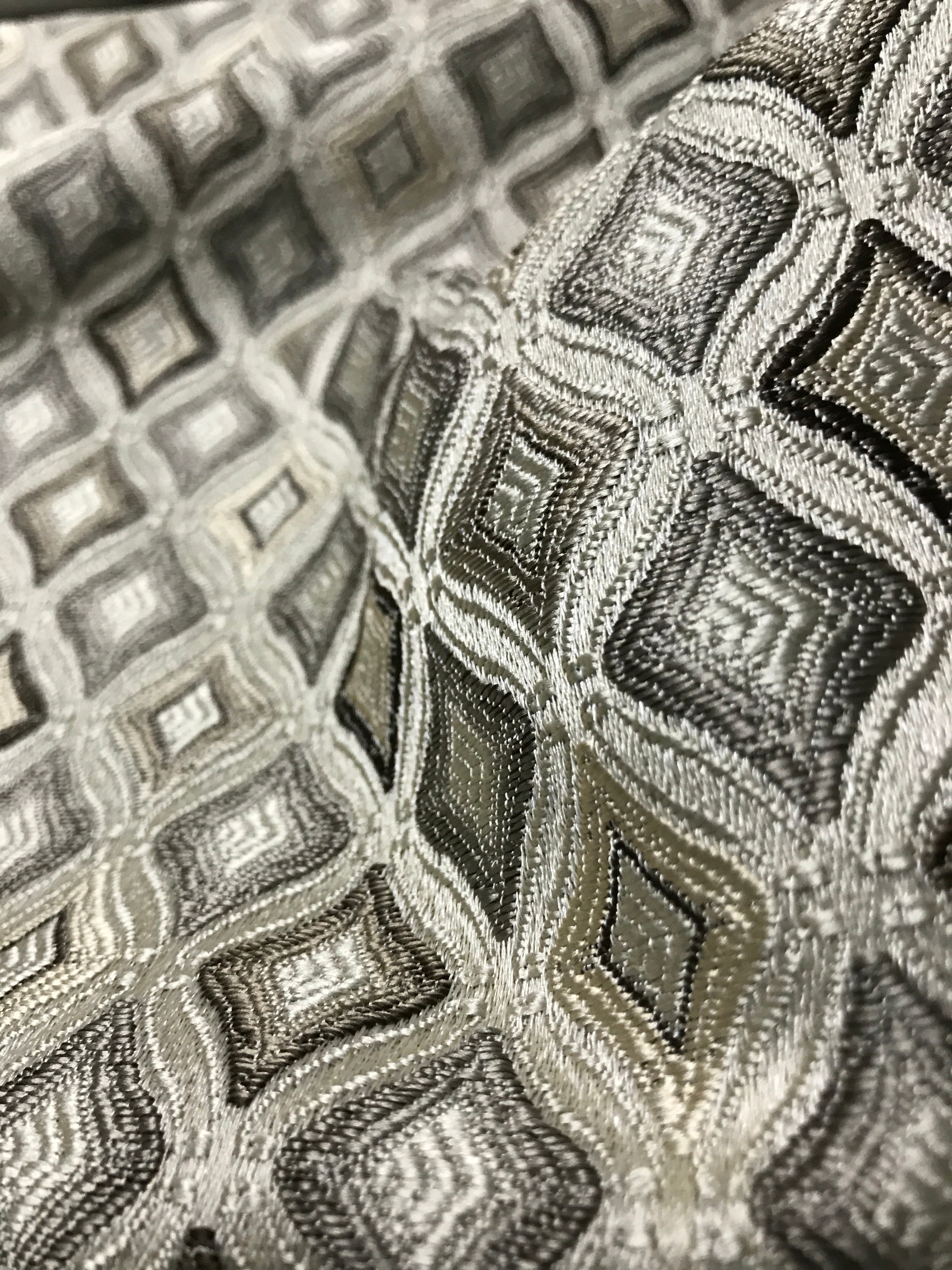 Close-up of a textured fabric with geometric pattern Stone Age