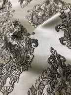 Close-up of black lace pattern on white fabric Stone Age