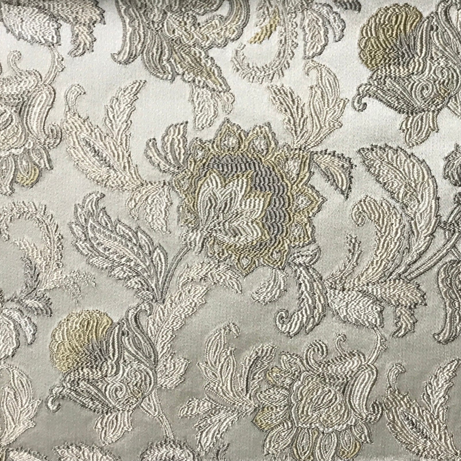 Decorative fabric with intricate floral patterns in Olive Sage on a light gray background