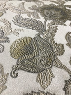 Close-up of decorative fabric with floral patterns on a neutral background Olive Sage