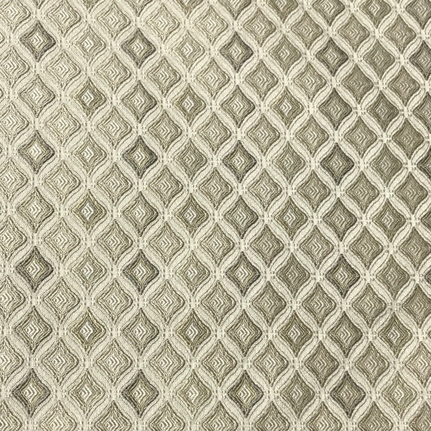 Patterned fabric with a geometric diamond design in beige and brown  tones. Olive Sage 
