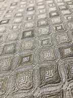 Close-up of textured fabric with geometric pattern Olive Sage