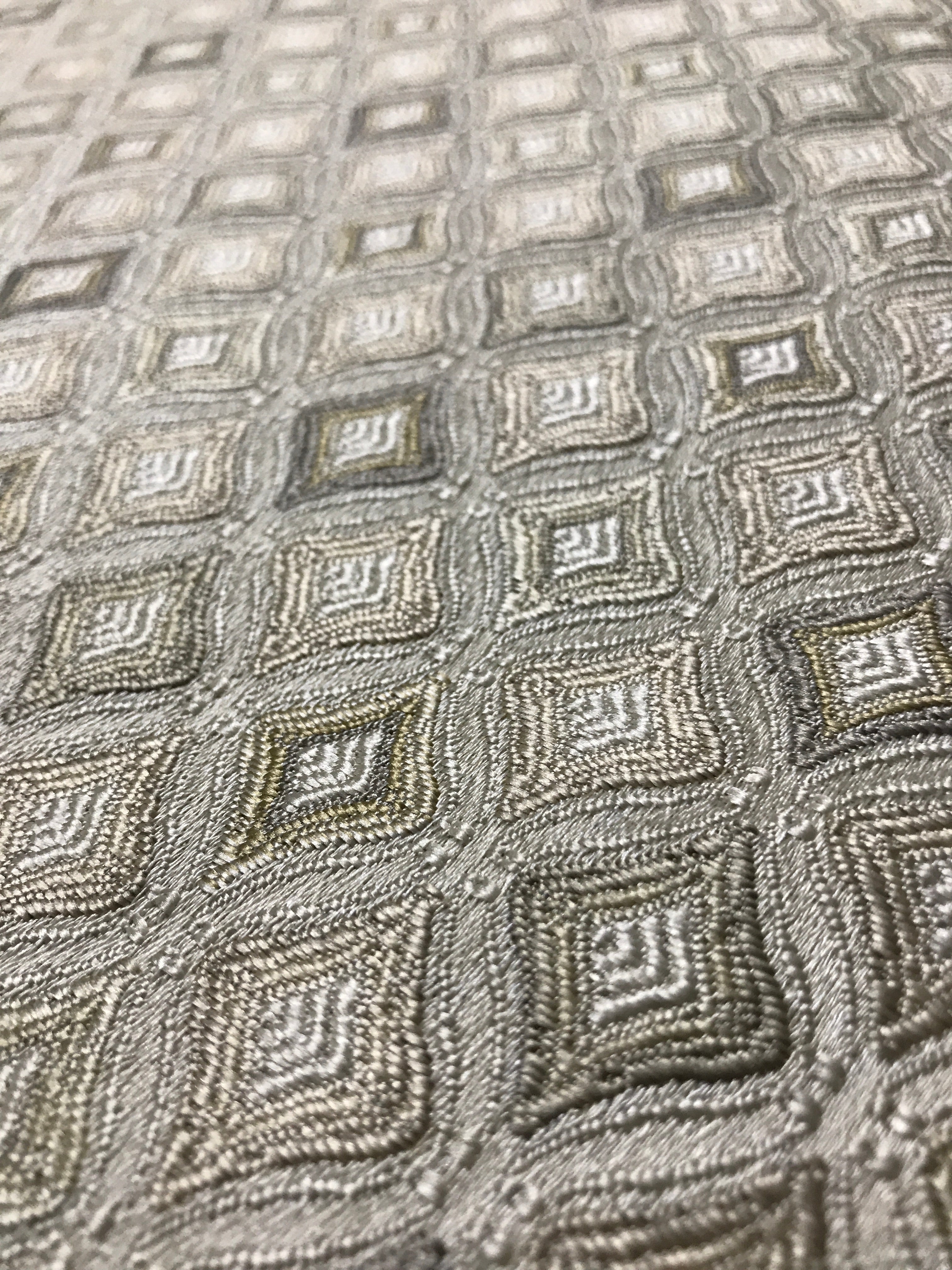Close-up of textured fabric with geometric pattern Olive Sage