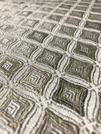 Close-up of textured fabric with geometric pattern Olive Sage