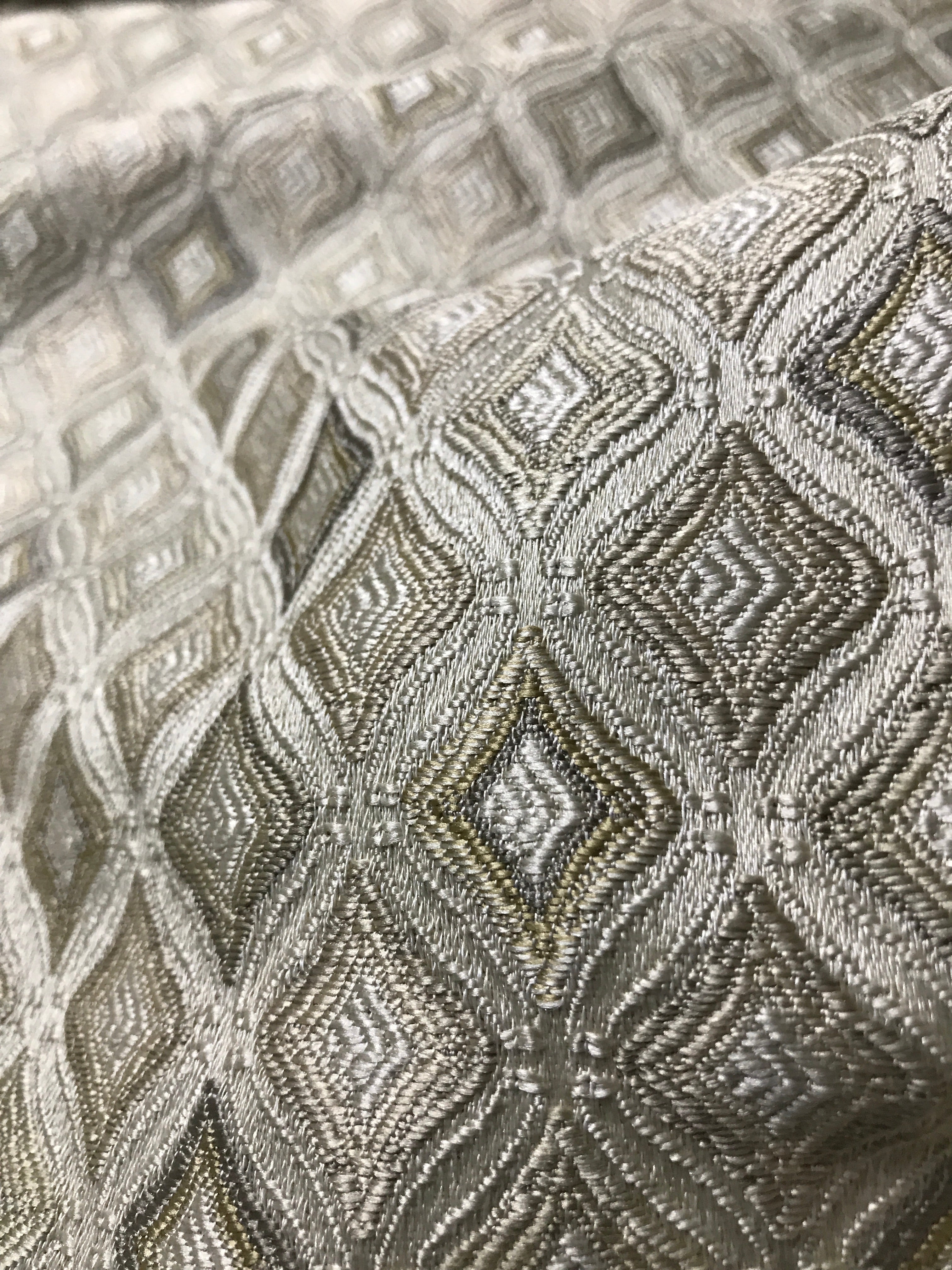 Close-up of textured fabric with geometric pattern Olive Sage