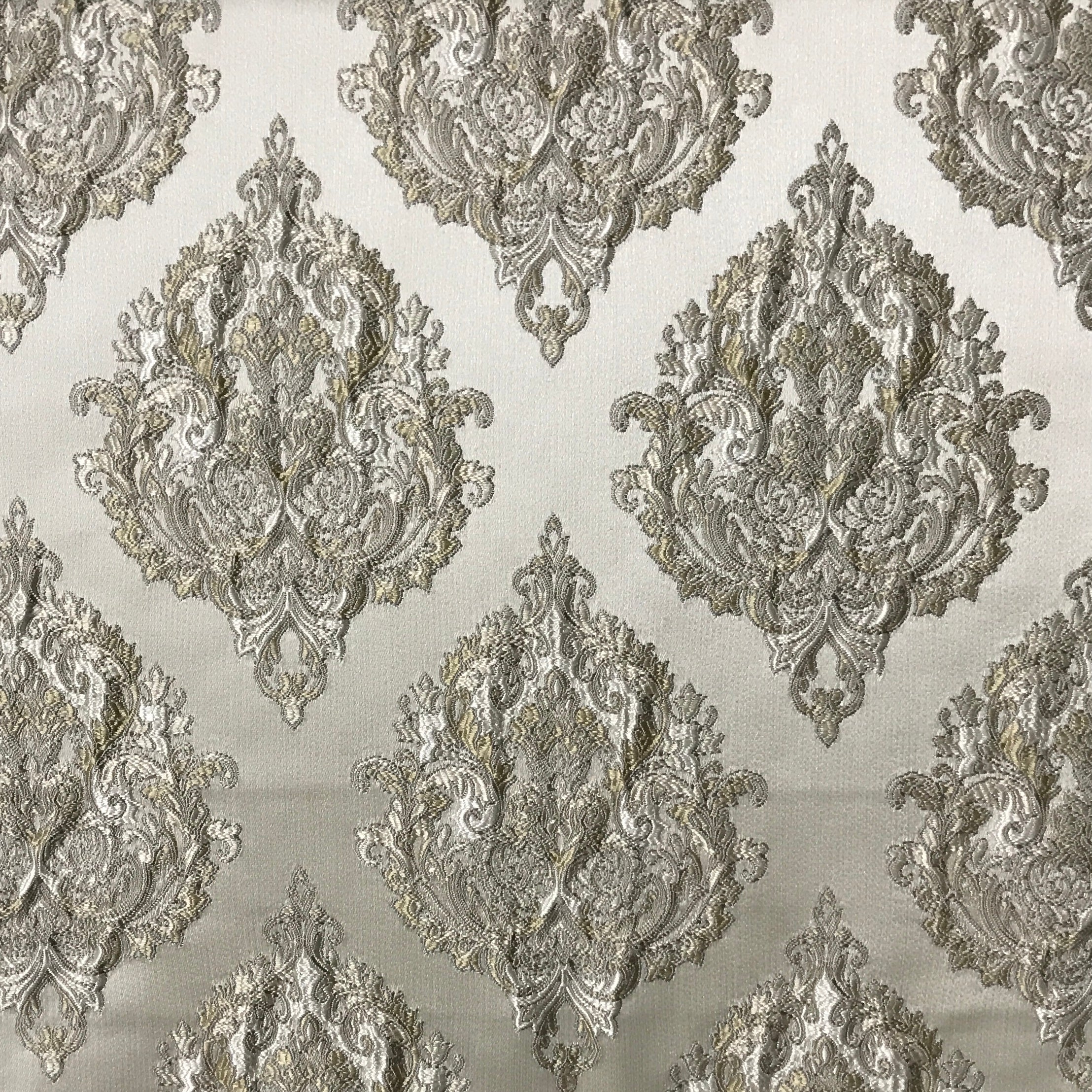 Decorative pattern with silver embossed designs on a light gray background Olive Sage