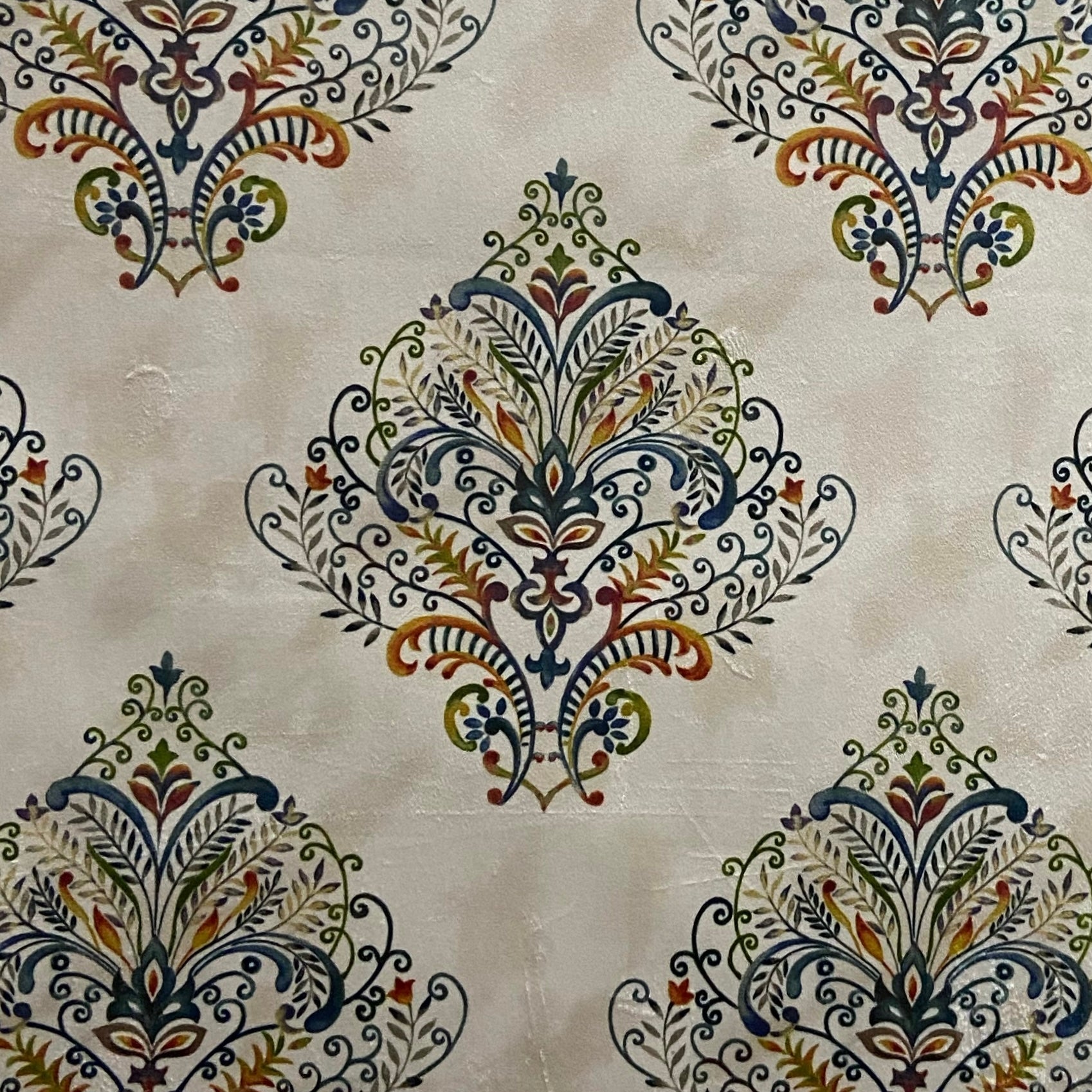 Decorative fabric pattern with Multicolor designs on a taupe background