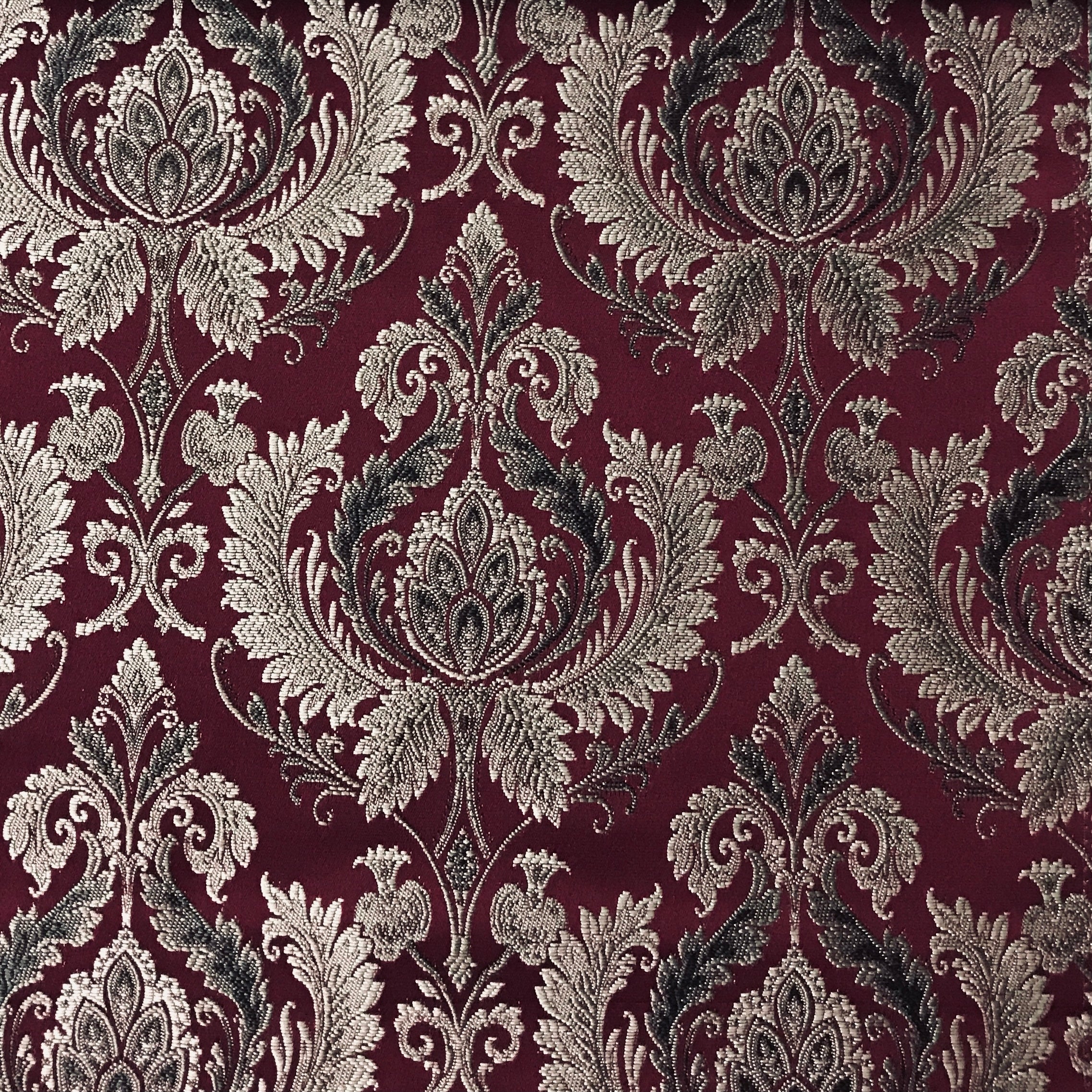 Maroon damask upholstery fabric by the yard, close-up pattern view