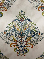 Decorative fabric pattern with Multicolor designs on a taupe background