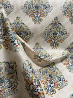 Decorative fabric pattern with Multicolor designs on a taupe background