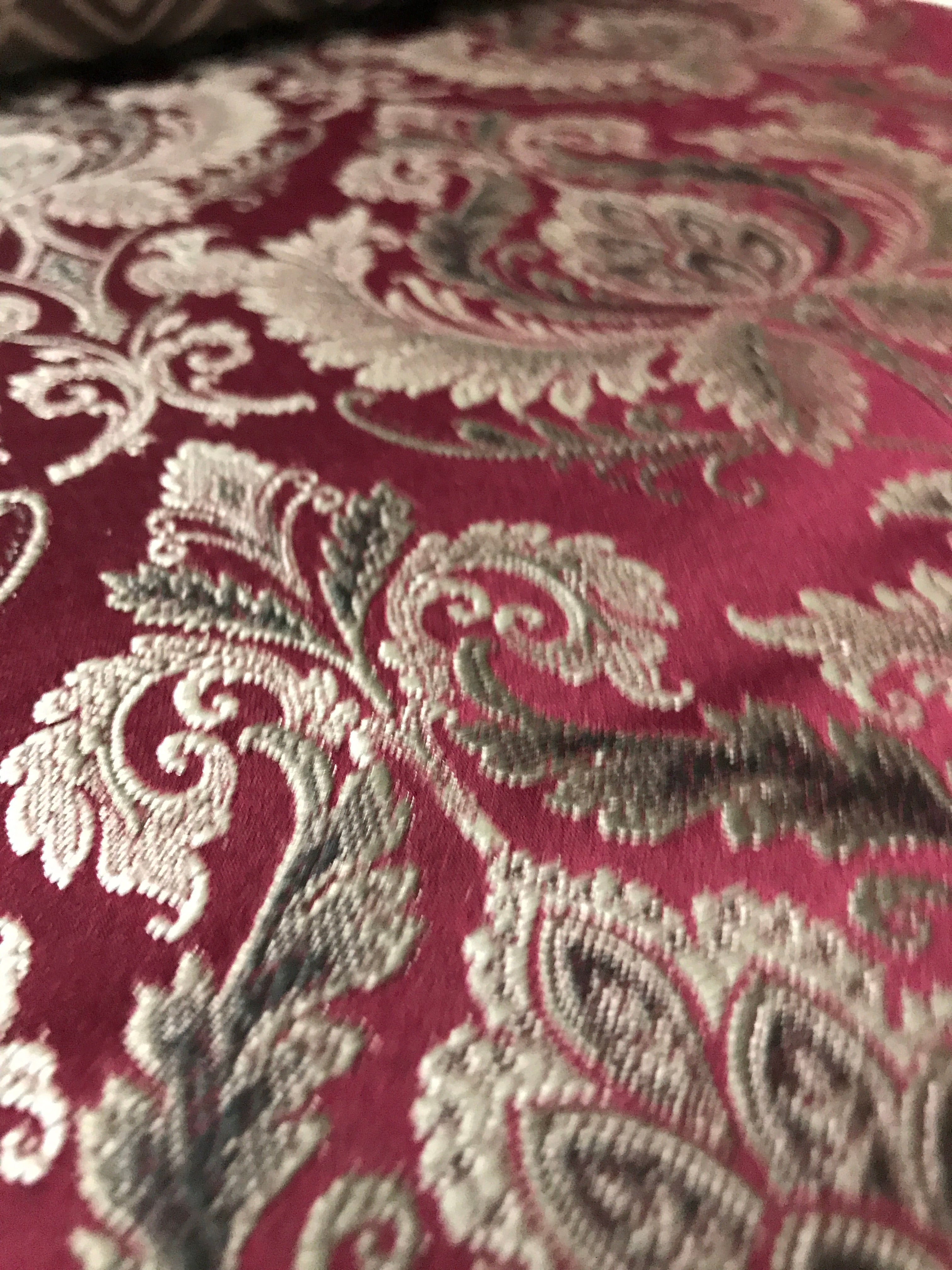 Maroon damask jacquard fabric close-up detail for dining chair reupholstery sold by the yard