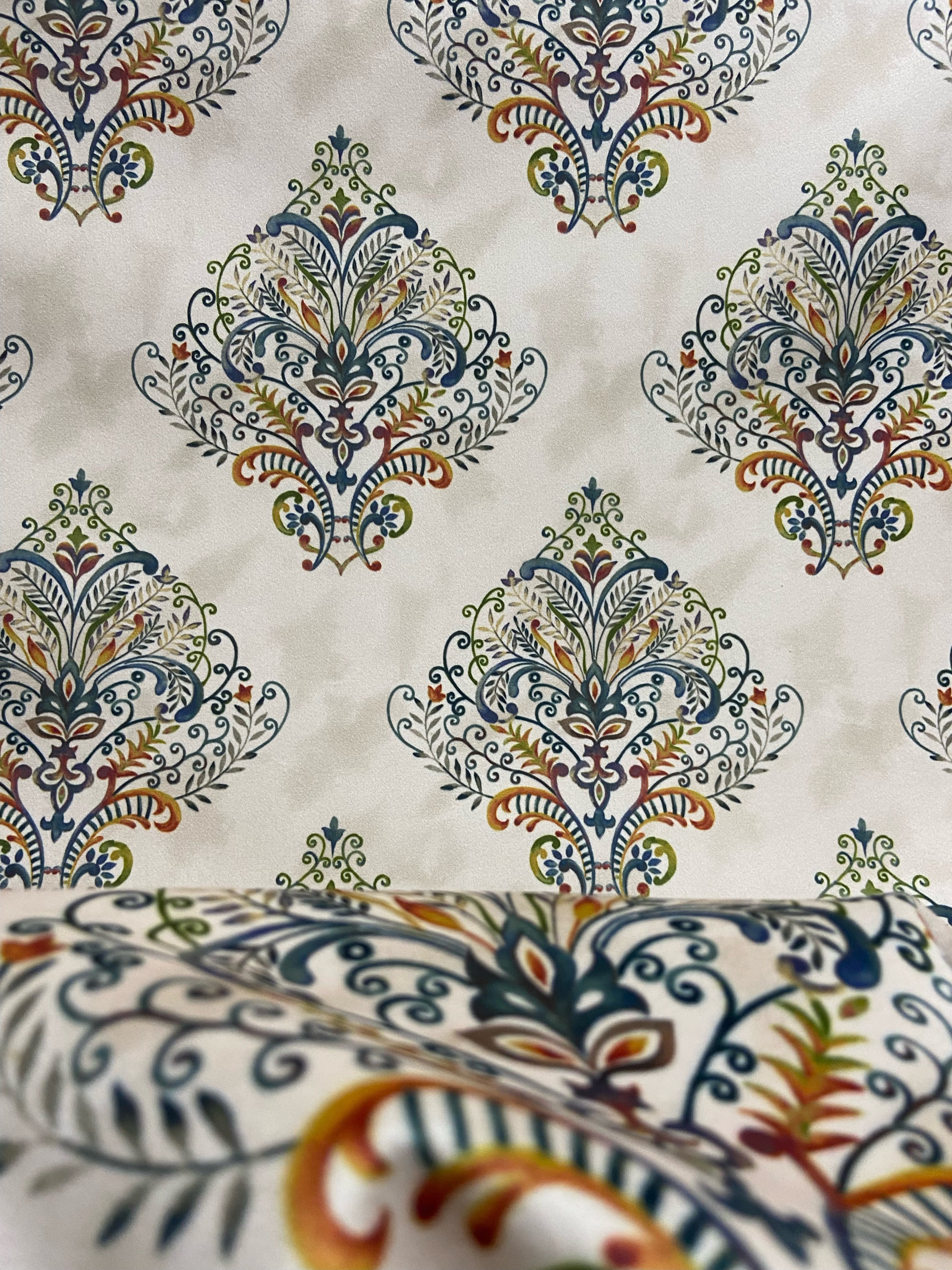 Decorative fabric pattern with Multicolor designs on a taupe background