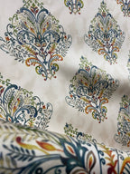 Decorative fabric pattern with Multicolor designs on a taupe background