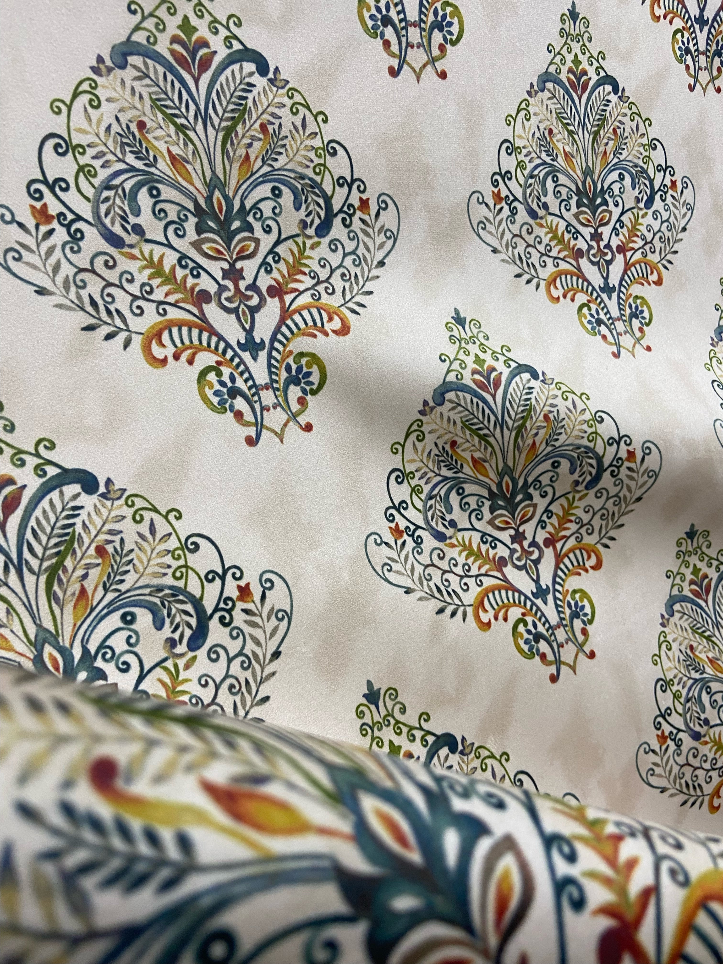 Decorative fabric pattern with Multicolor designs on a taupe background