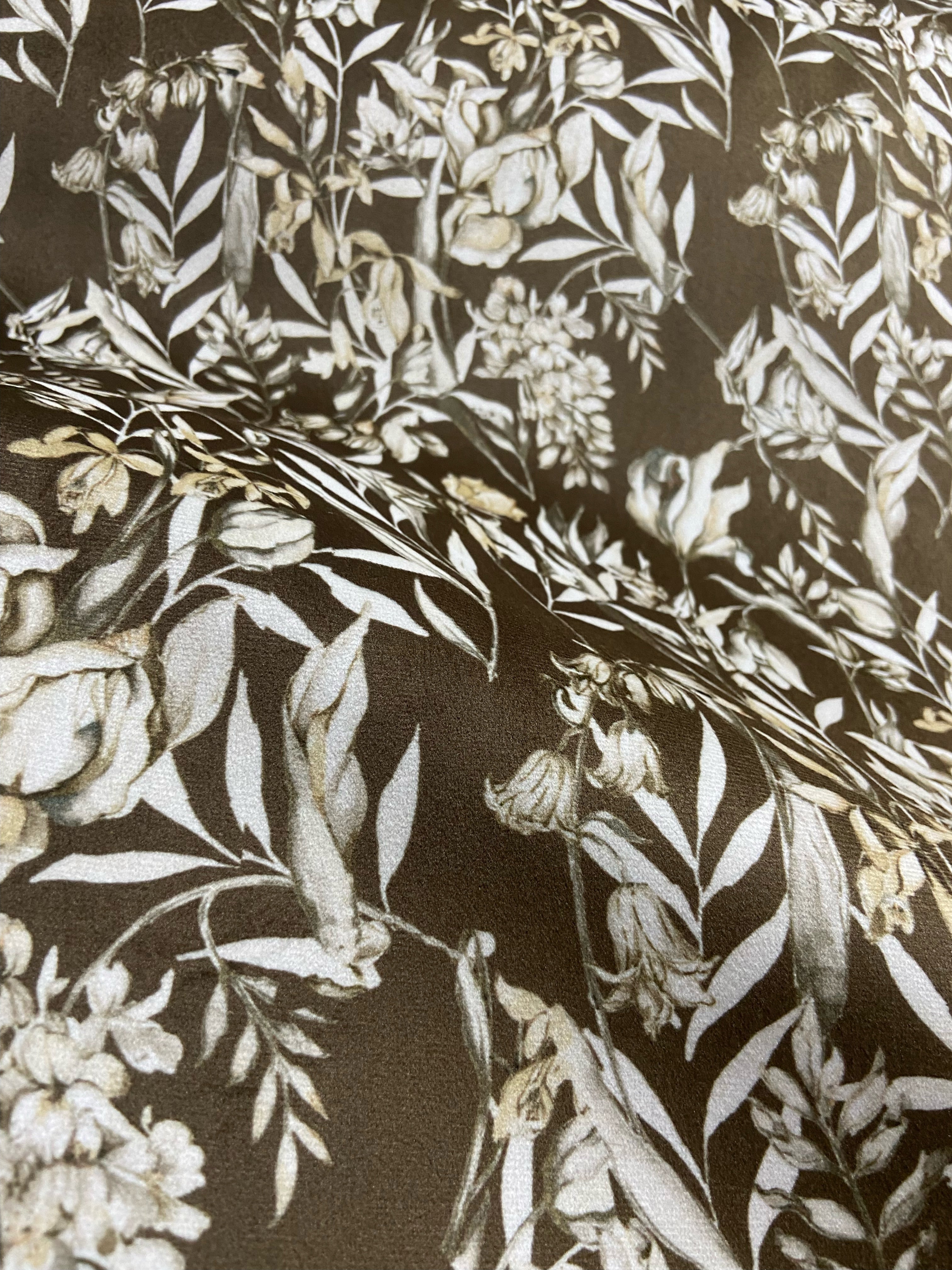 Floral pattern with green leaves and white flowers on Umber colored background