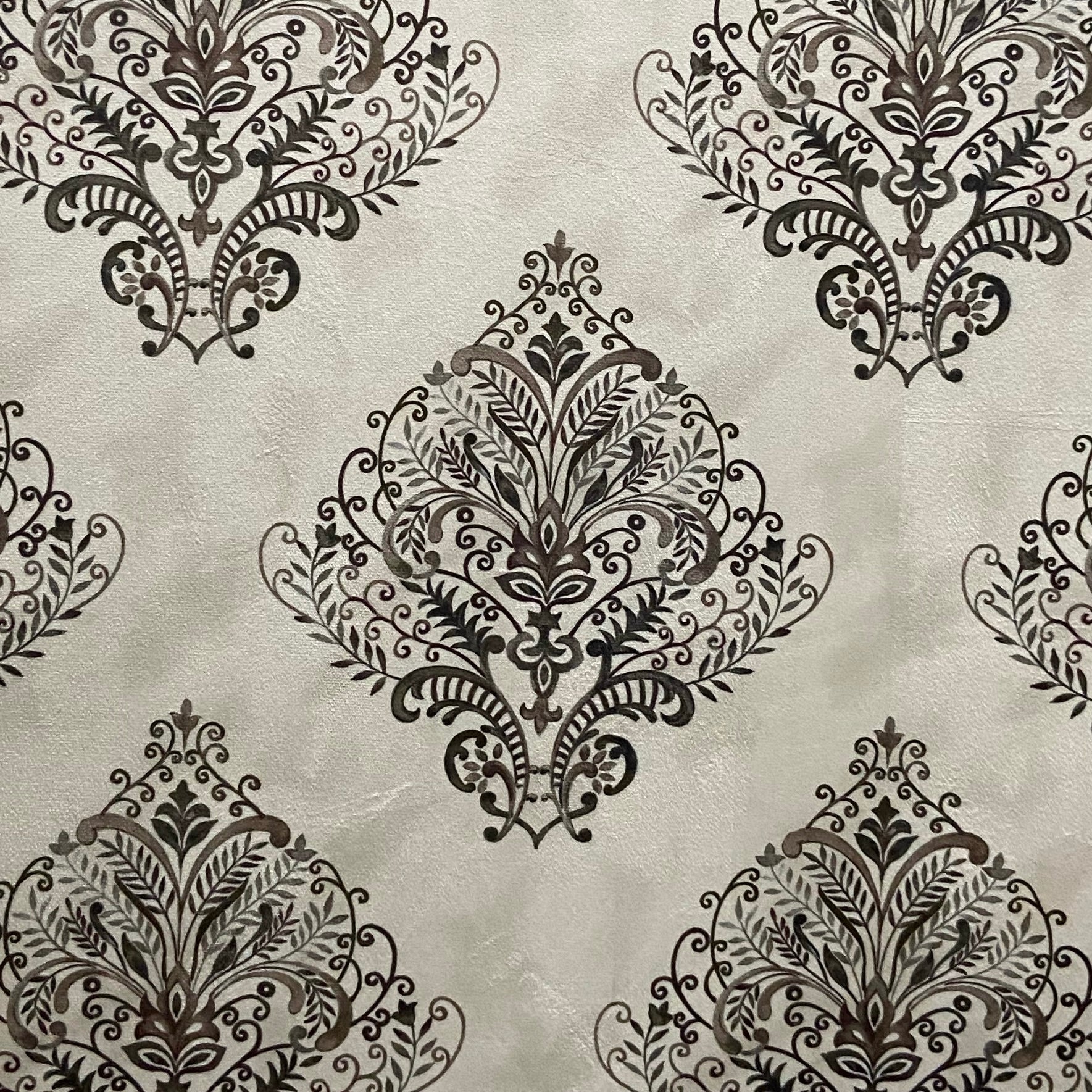 Decorative fabric pattern with Brown designs on a taupe background