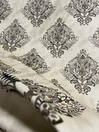 Decorative fabric pattern with Brown designs on a taupe background