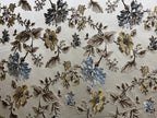 Floral pattern with Blue and brown flowers on a light background