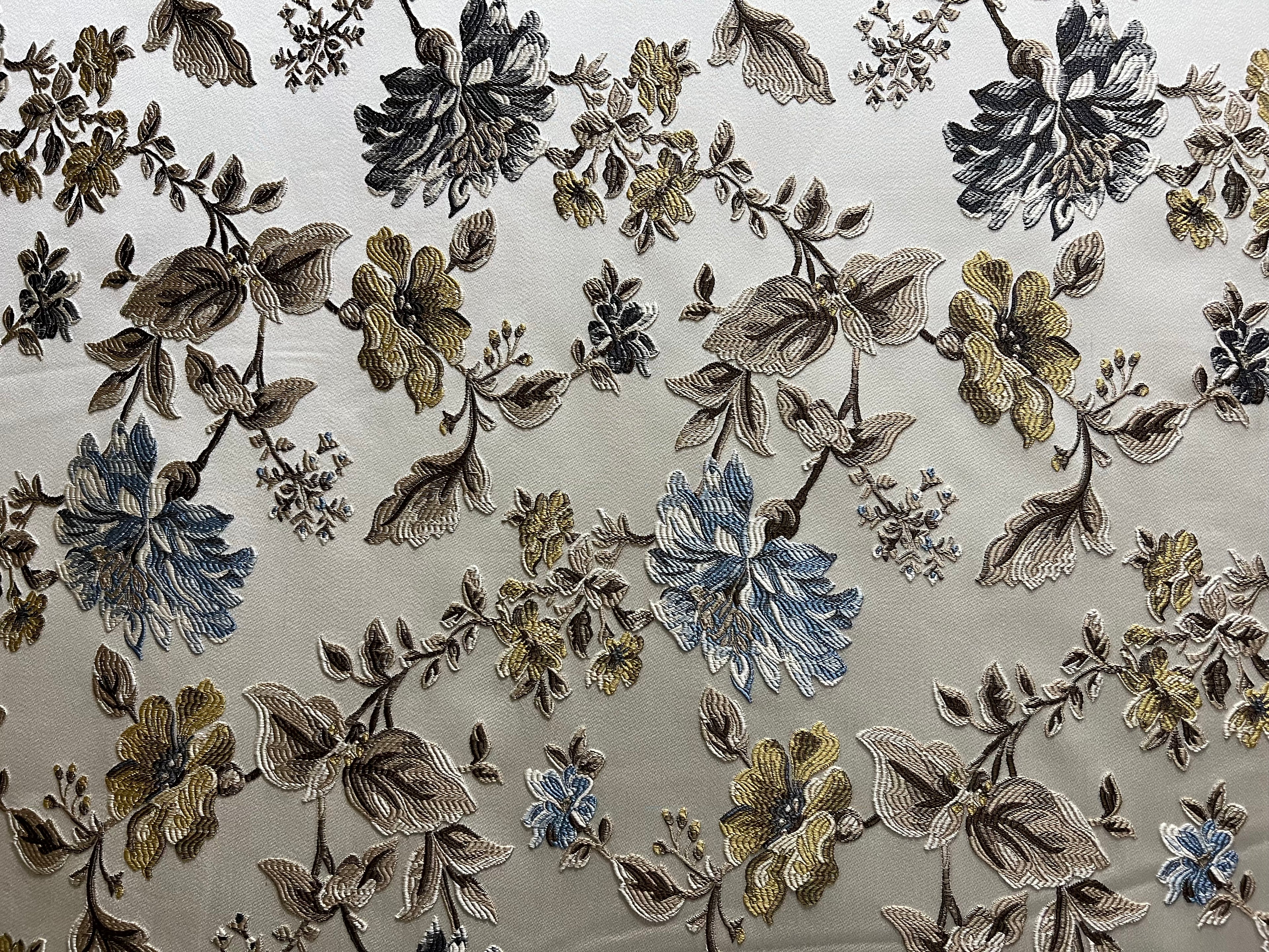 Floral pattern with Blue and brown flowers on a light background