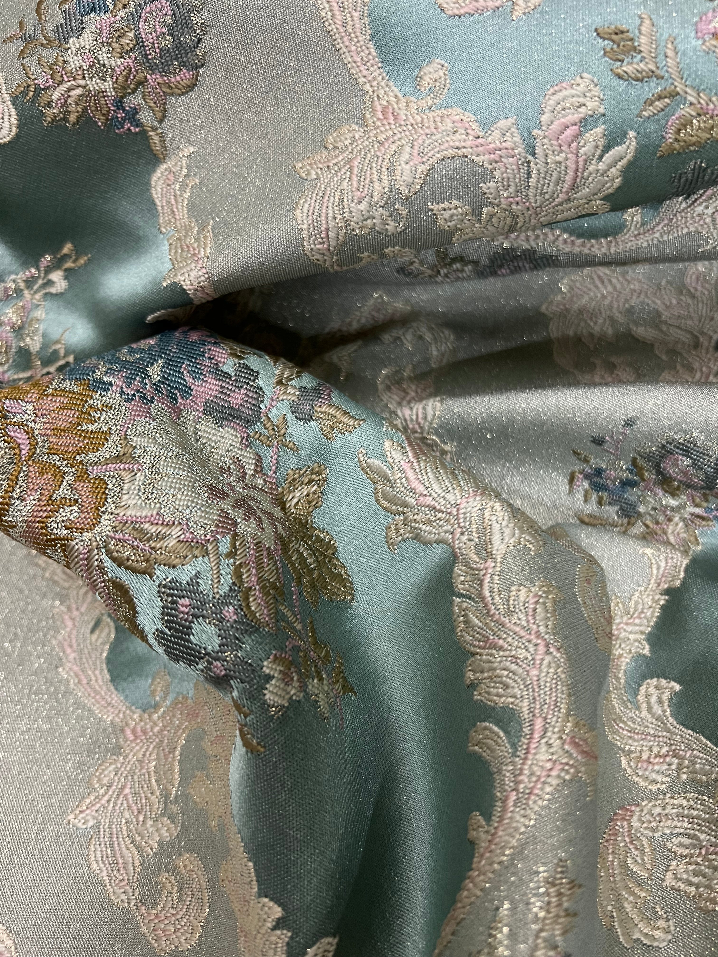 Decorative floral and leaf pattern on a Teal Blue background