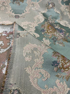 Decorative floral and leaf pattern on a Teal Blue background