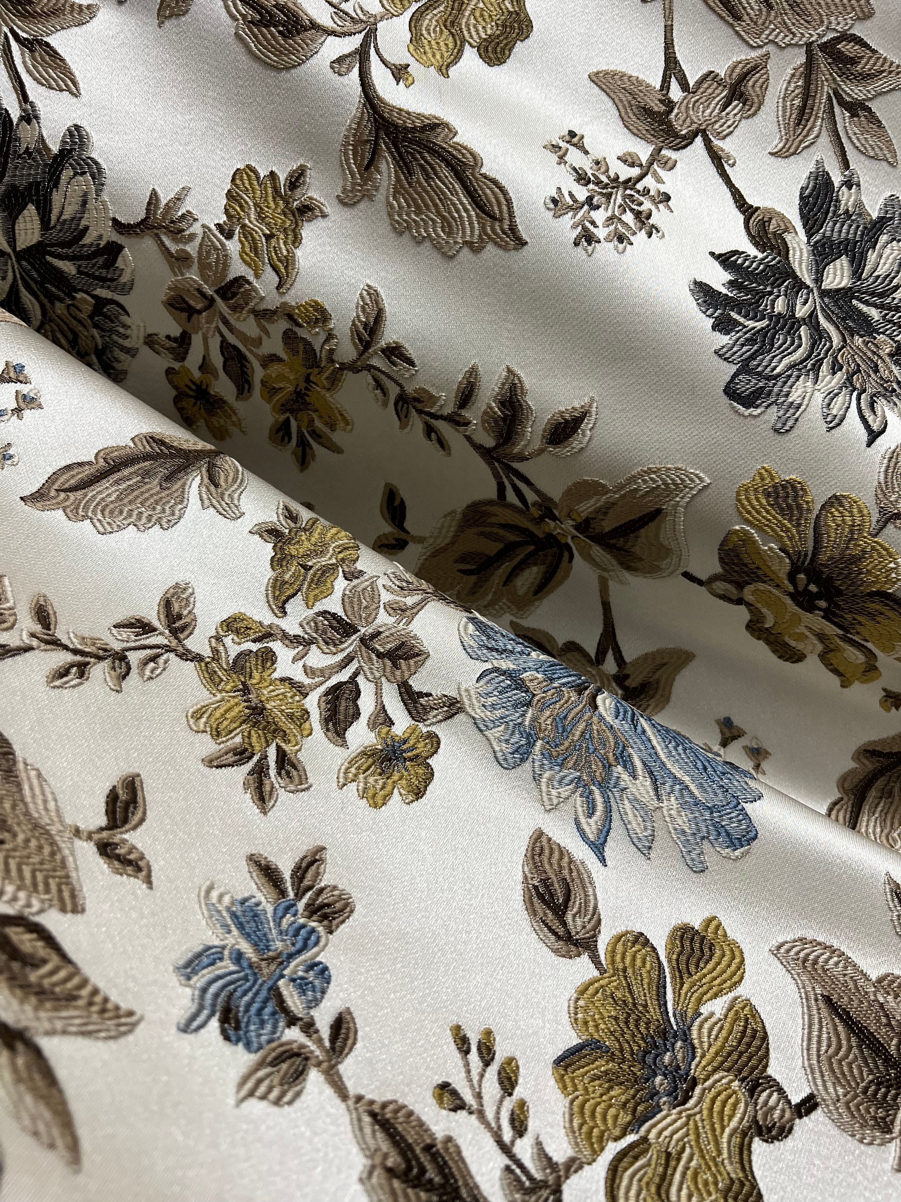 Floral pattern with Blue and brown flowers on a light background
