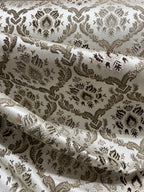 Decorative fabric with intricate Brown floral pattern on a beige background