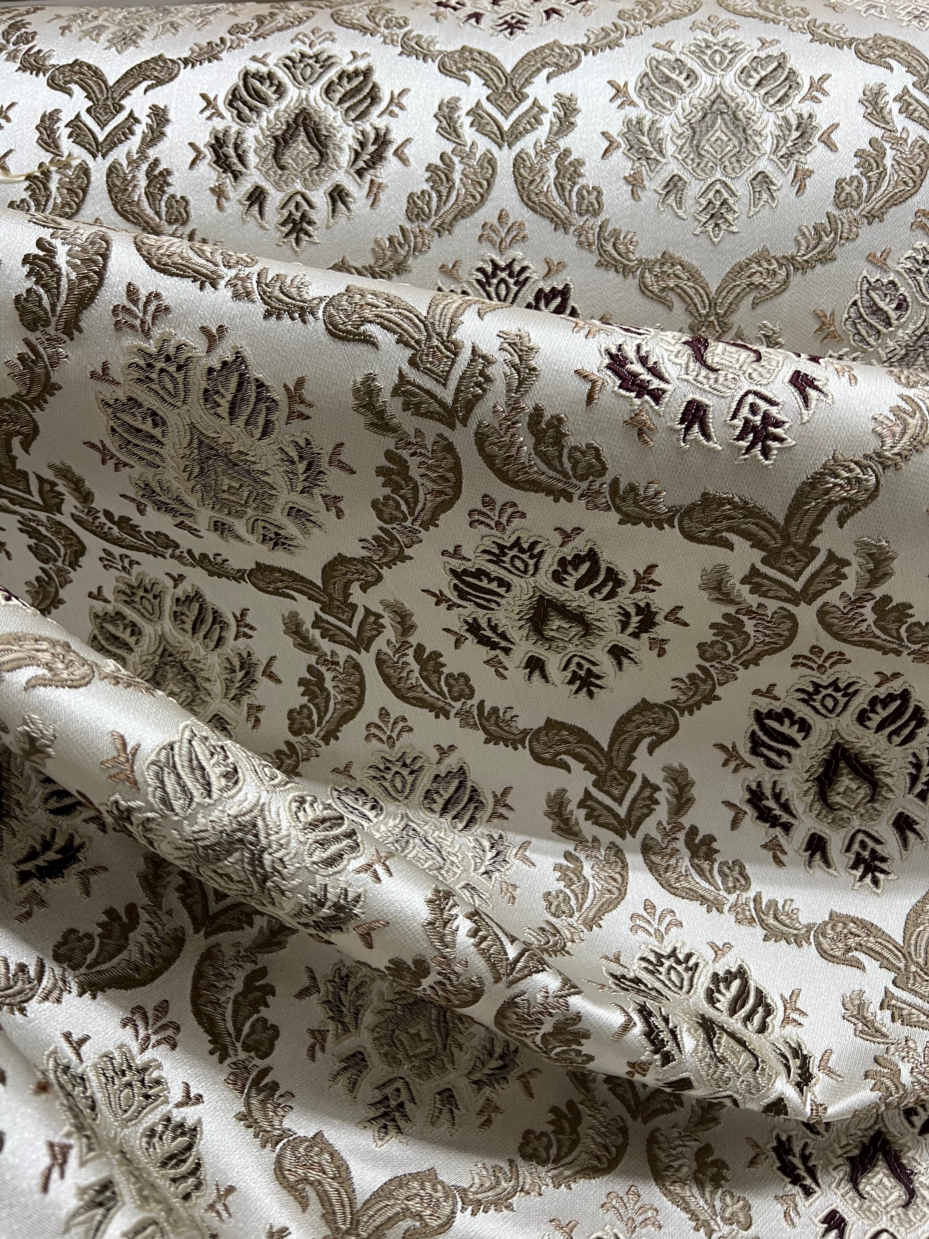 Decorative fabric with intricate Brown floral pattern on a beige background