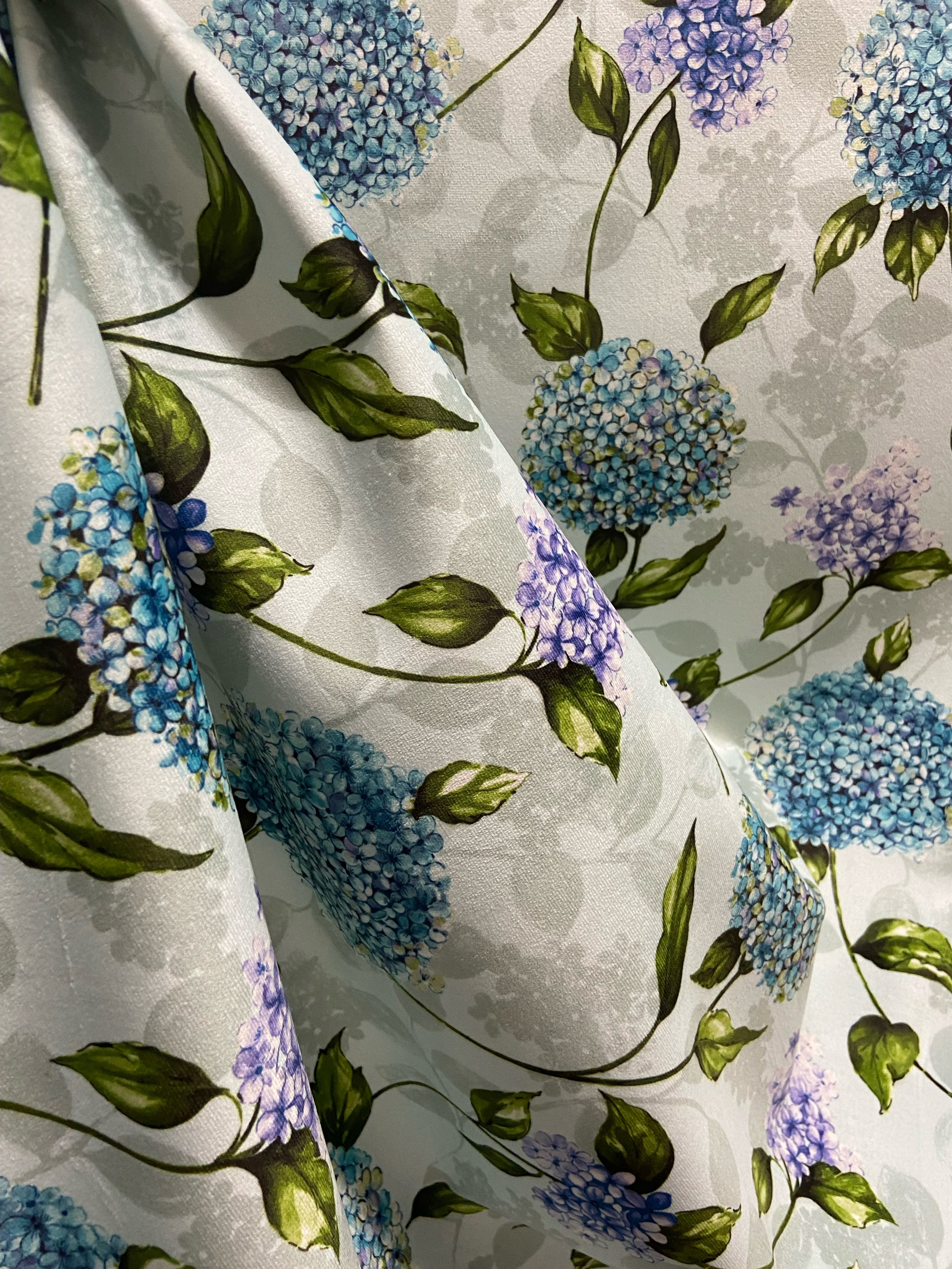 Pattern of Blue and purple Hydrangea on taupe background