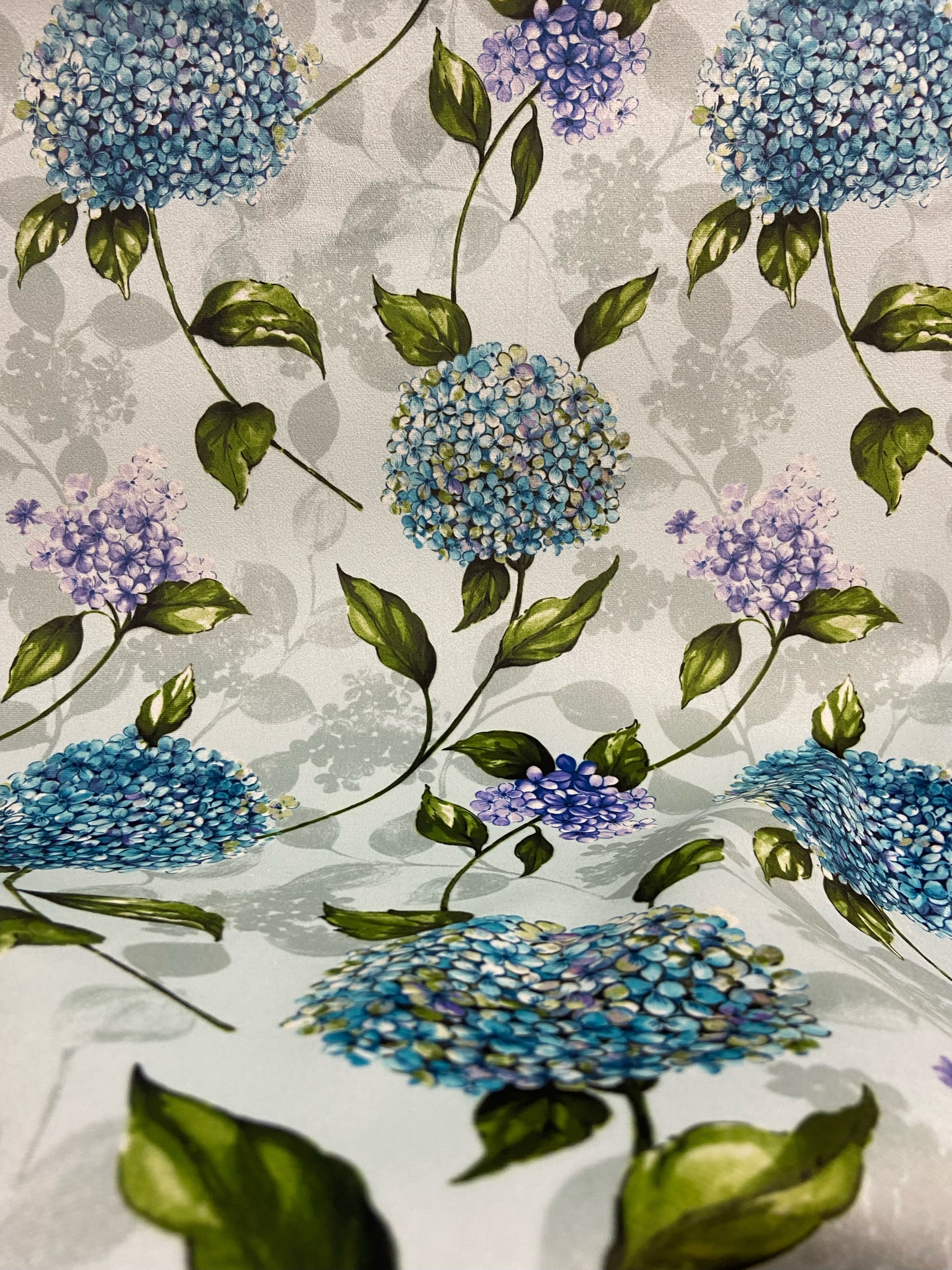 Pattern of Blue and purple Hydrangea on taupe background