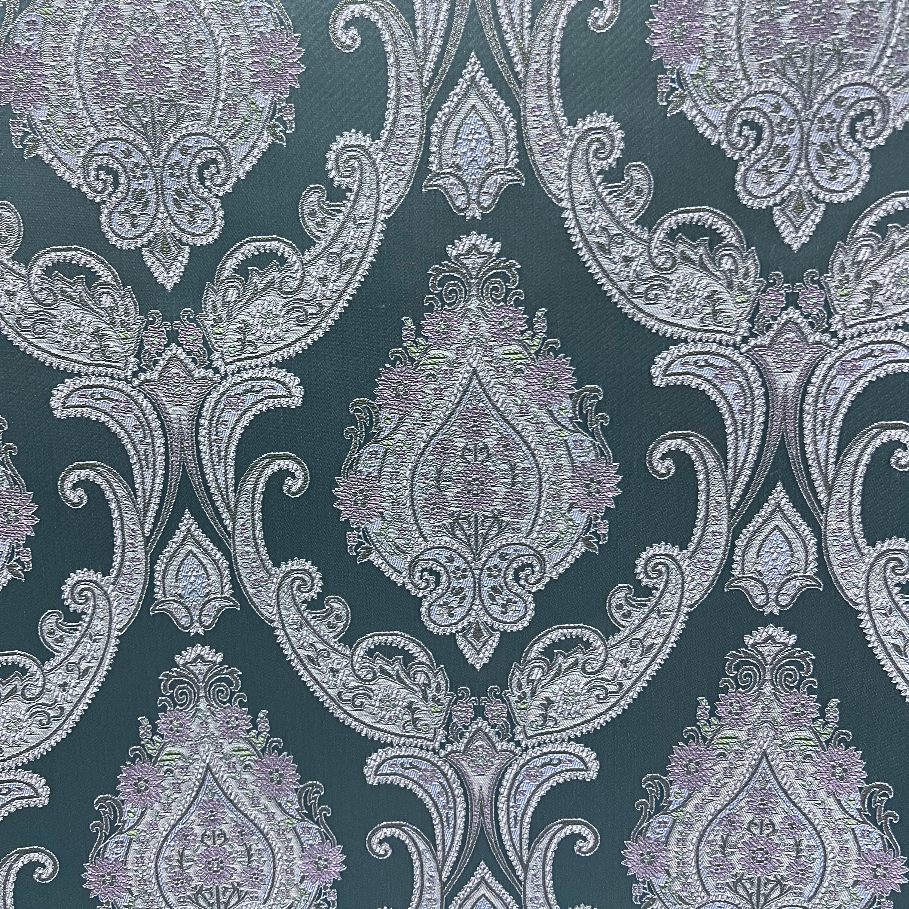 Decorative Damask Paisley pattern with intricate designs on a Teal Blue background