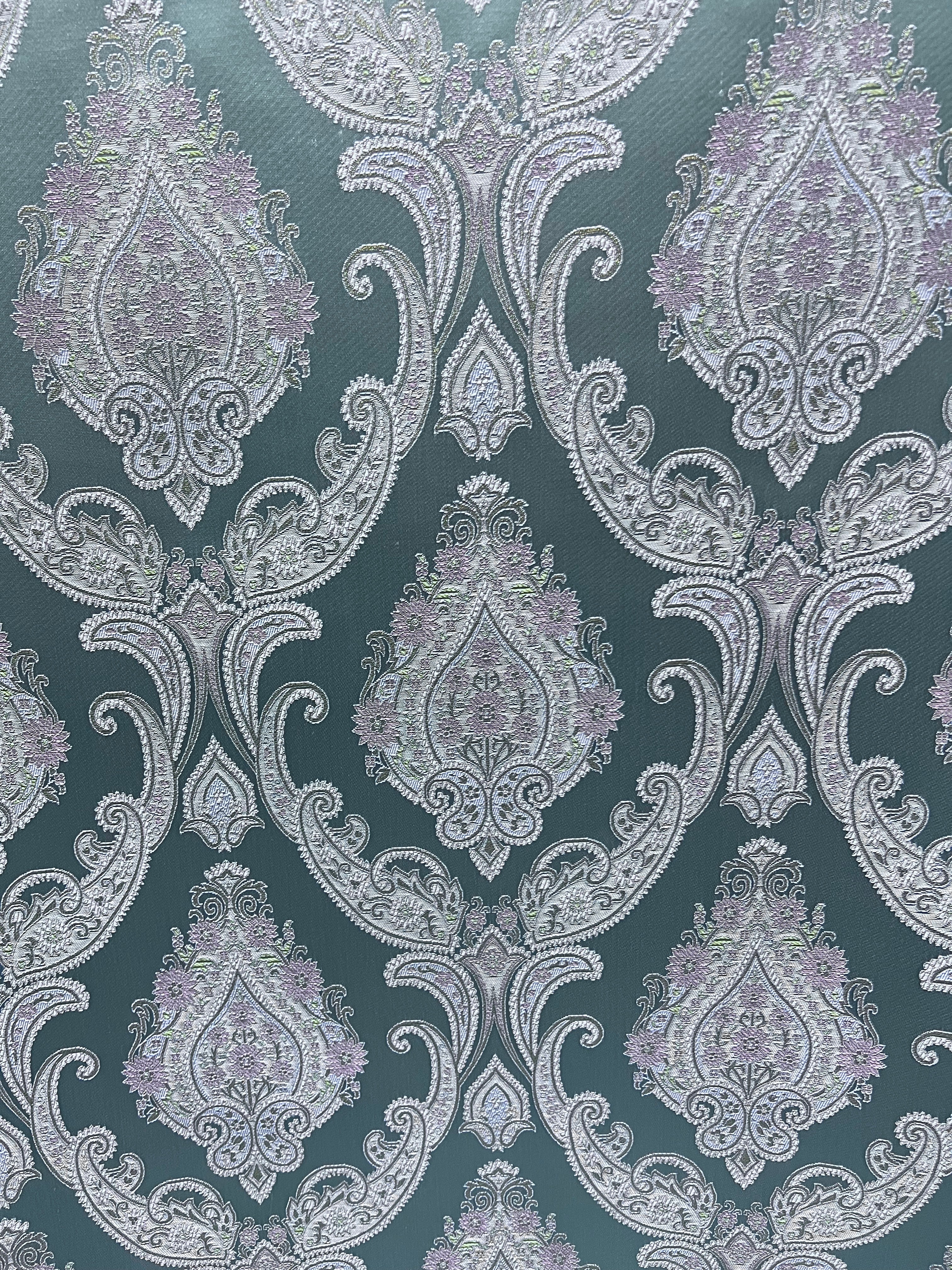 Decorative Damask Paisley pattern with intricate designs on a Teal Blue background