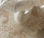 Close-up of damask ornate floral pattern on fabric with Beige color background