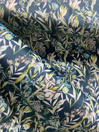 Floral pattern with green leaves and white flowers on Peacock Blue background