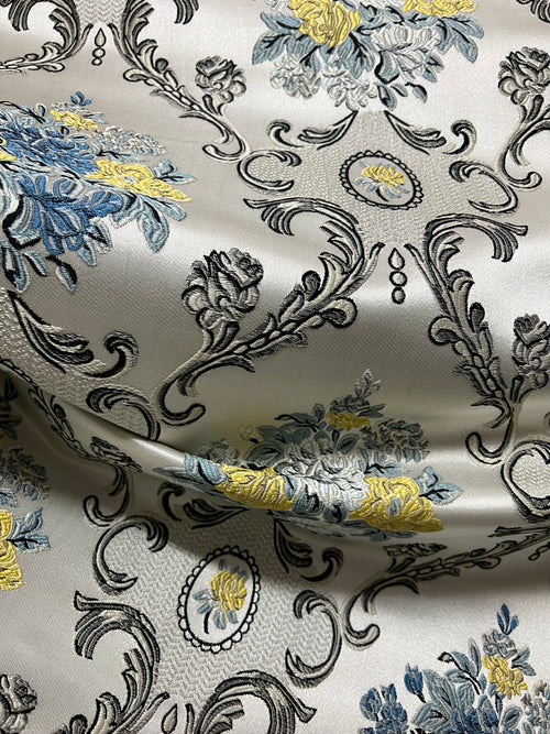 Decorative floral and damask baroque pattern with Blue and yellow flowers on a beige background