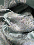 Decorative Damask Paisley pattern with intricate designs on a Teal Blue background