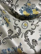 Decorative floral and damask baroque pattern with Blue and yellow flowers on a beige background