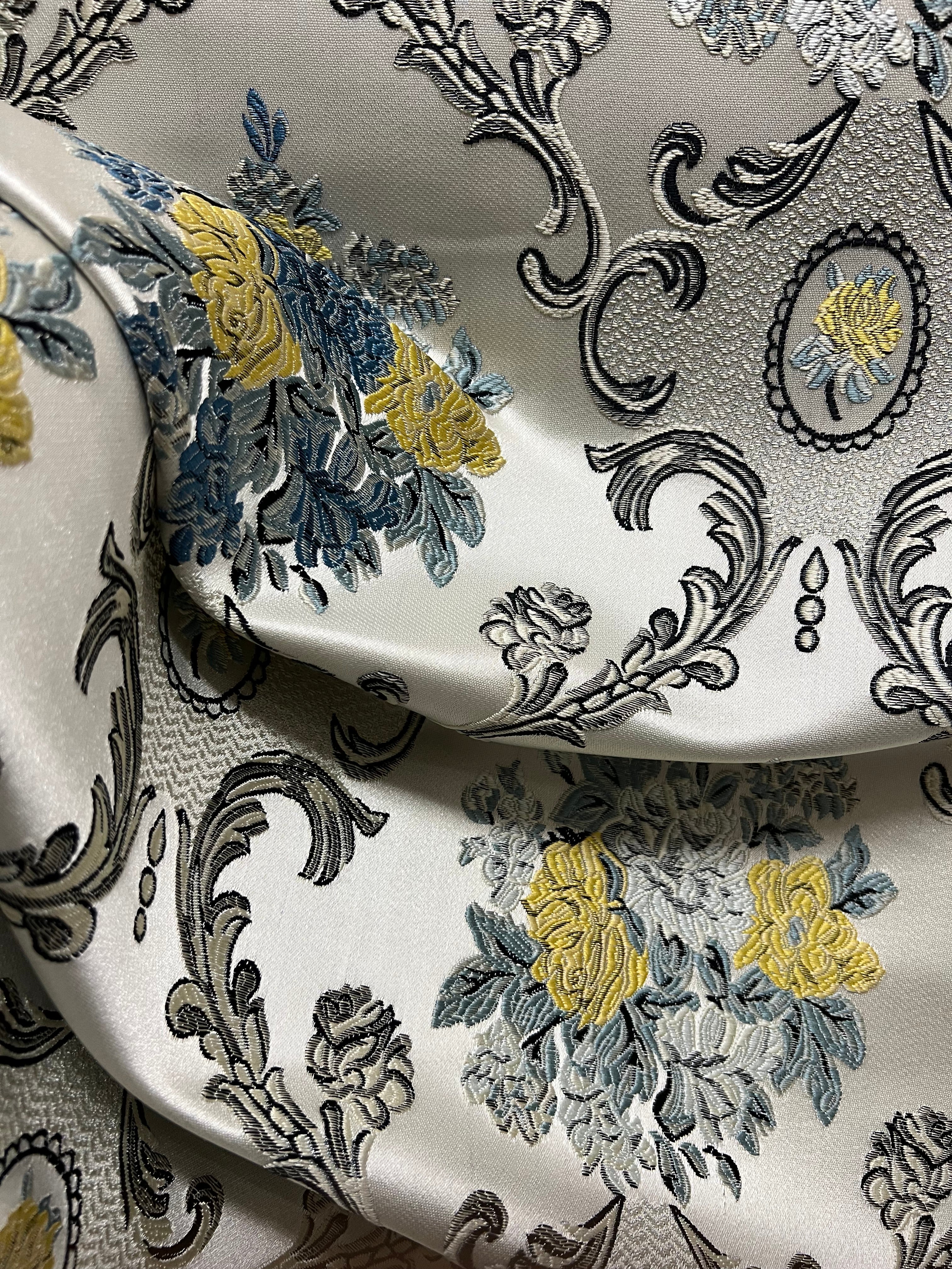 Decorative floral and damask baroque pattern with Blue and yellow flowers on a beige background