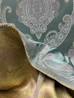 Decorative Damask Paisley pattern with intricate designs on a Teal Blue background