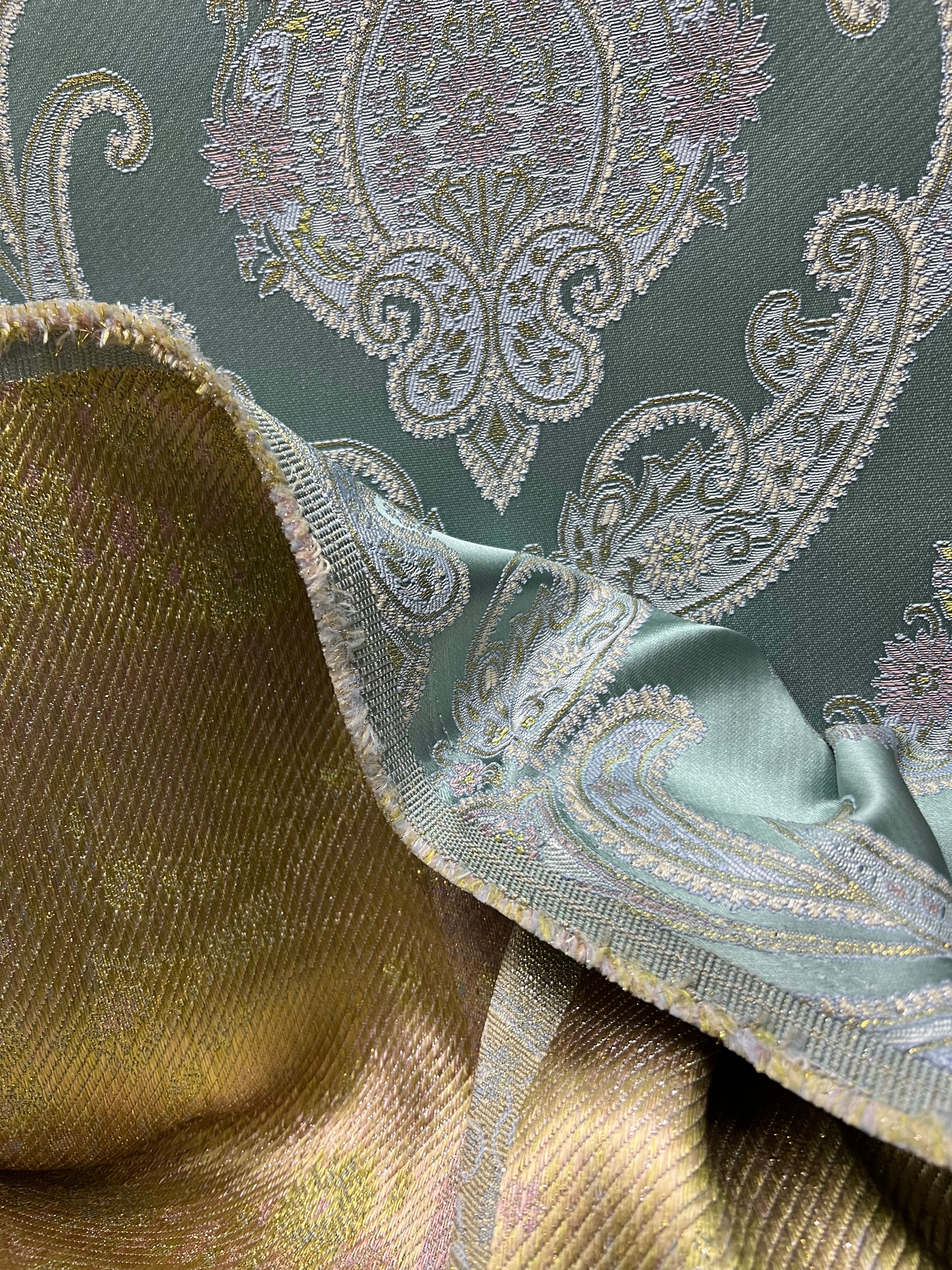 Decorative Damask Paisley pattern with intricate designs on a Teal Blue background