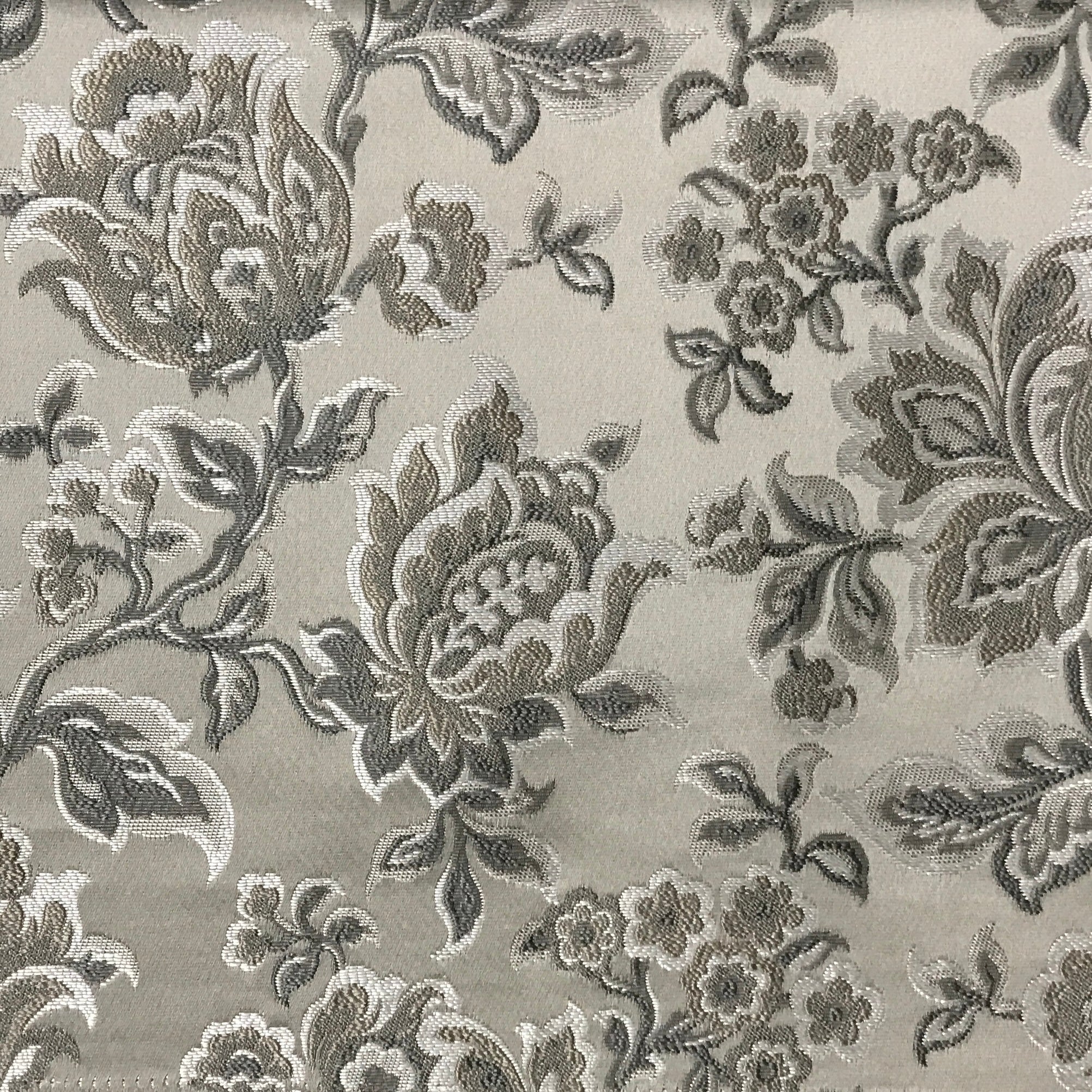 Silver floral jacquard upholstery fabric by the yard, close-up pattern view.