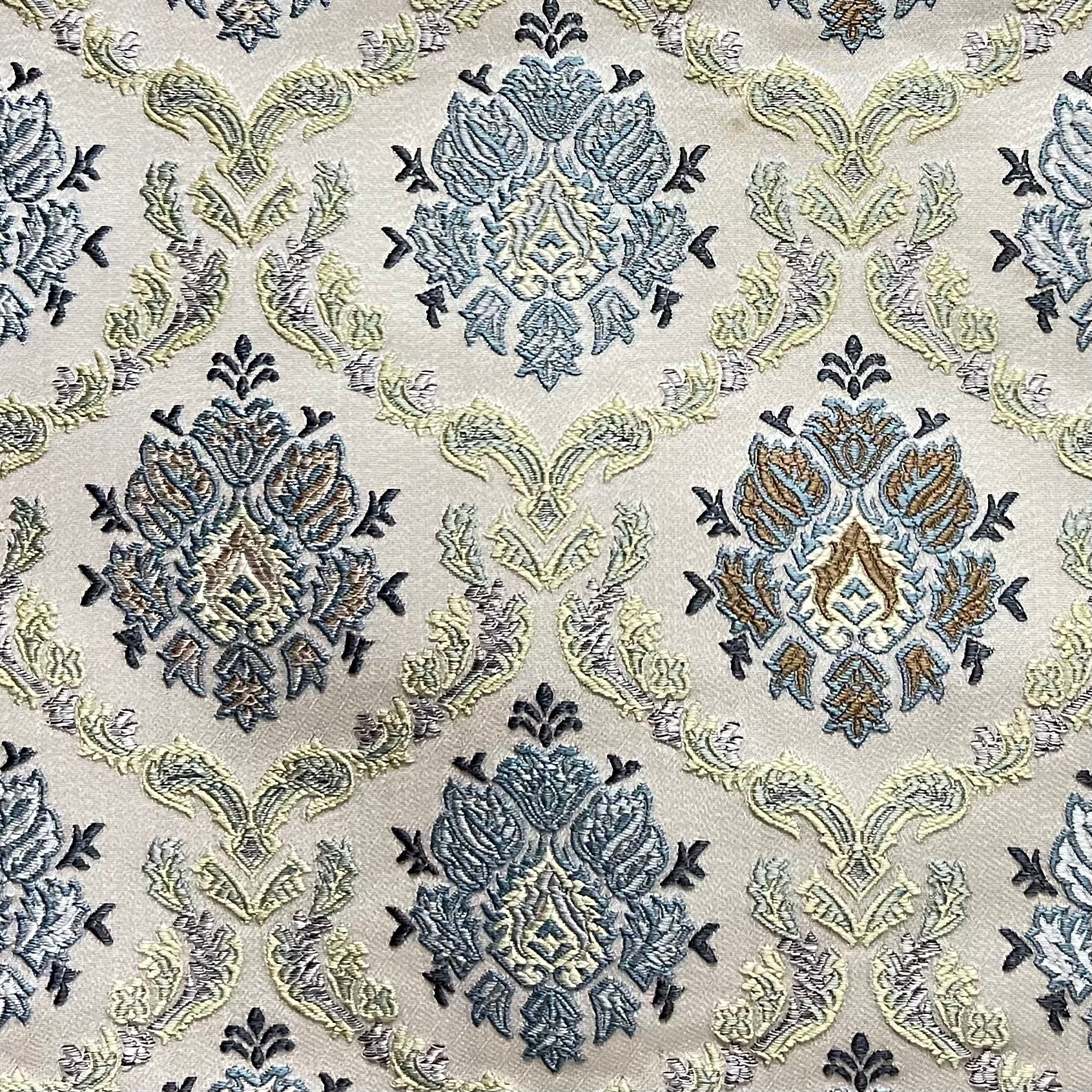 Decorative fabric with intricate Blue floral pattern on a beige background