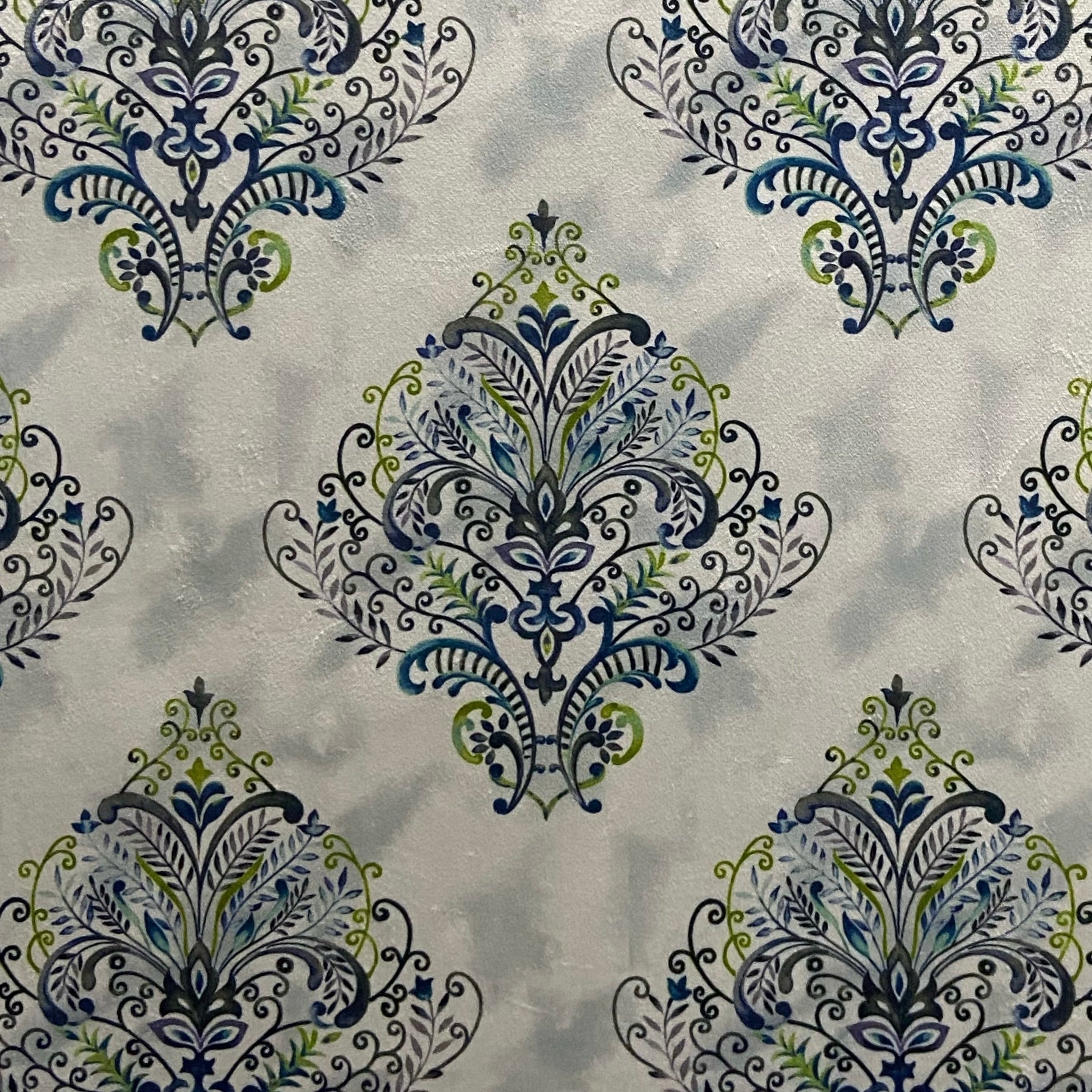 Decorative fabric pattern with Blue designs on a taupe background