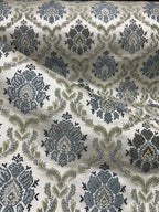 Decorative fabric with intricate Blue floral pattern on a beige background