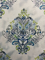 Decorative fabric pattern with Blue designs on a taupe background