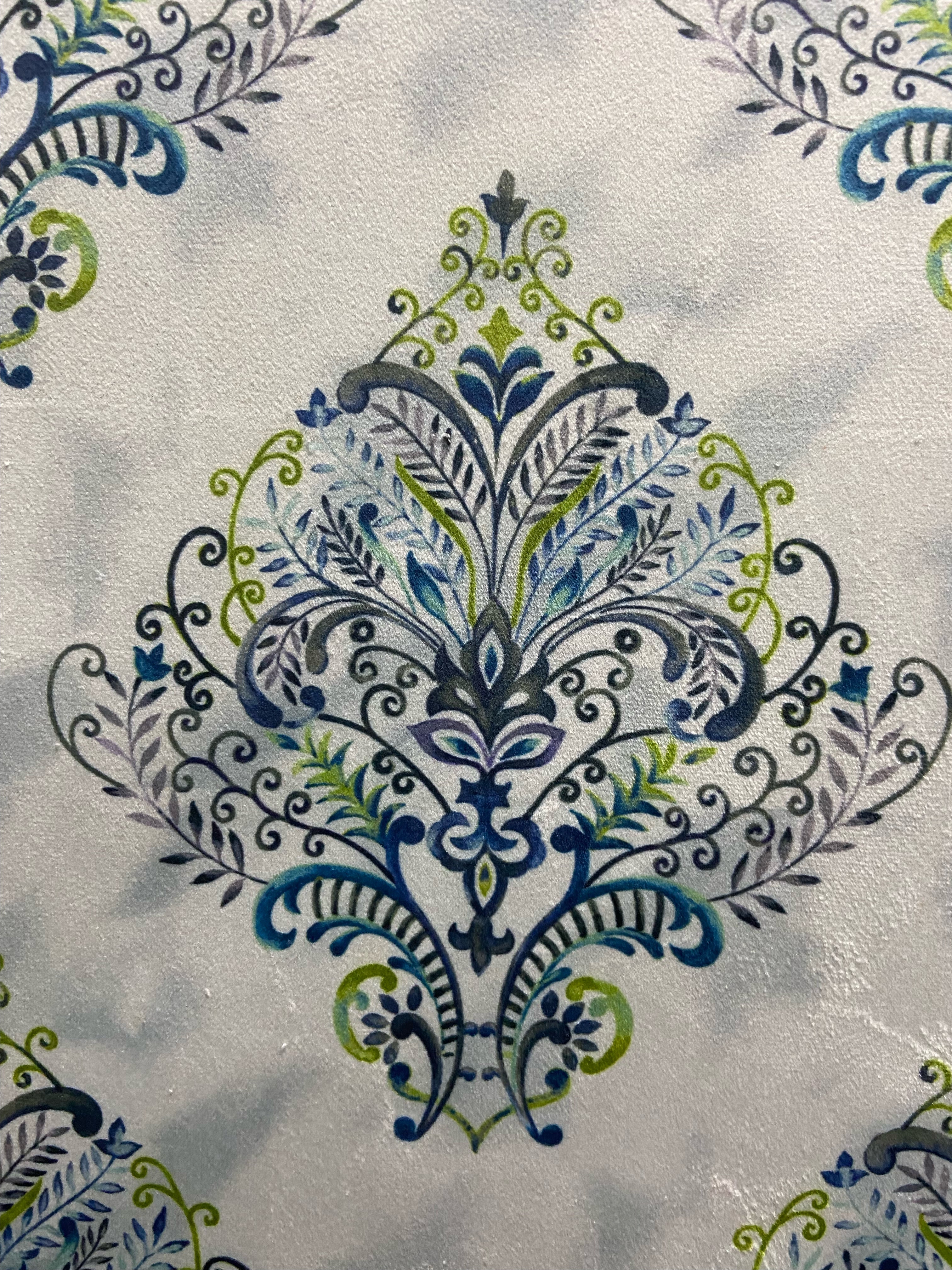Decorative fabric pattern with Blue designs on a taupe background